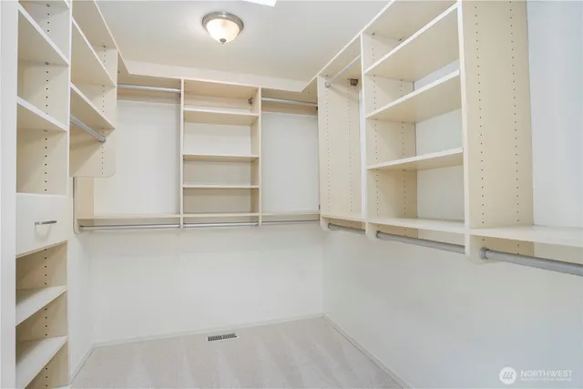 a view of an empty walk in closet