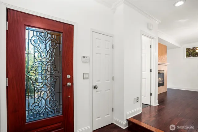 a view of an entryway with wooden floor