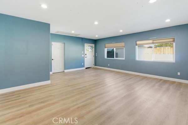 5048 Hesperia Avenue Encino, CA 91316 - Photo 26 of 30 a view of an empty room with wooden floor and a window