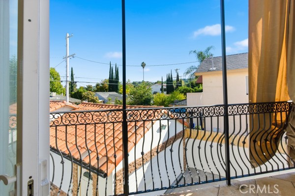 5048 Hesperia Avenue Encino, CA 91316 - Photo 27 of 30 a view of a balcony with tall trees