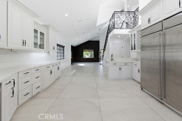 5048 Hesperia Avenue Encino, CA 91316 - Photo 3 of 30 a bathroom with a sink a mirror and a shower