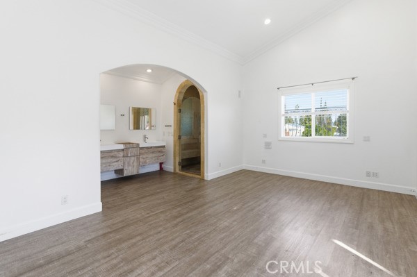 5048 Hesperia Avenue Encino, CA 91316 - Photo 5 of 30 wooden floor in an empty room with a window