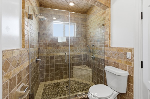5048 Hesperia Avenue Encino, CA 91316 - Photo 8 of 30 a bathroom with a toilet and shower