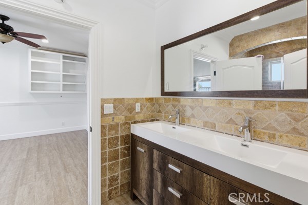 5048 Hesperia Avenue Encino, CA 91316 - Photo 9 of 30 a bathroom with a sink and a mirror