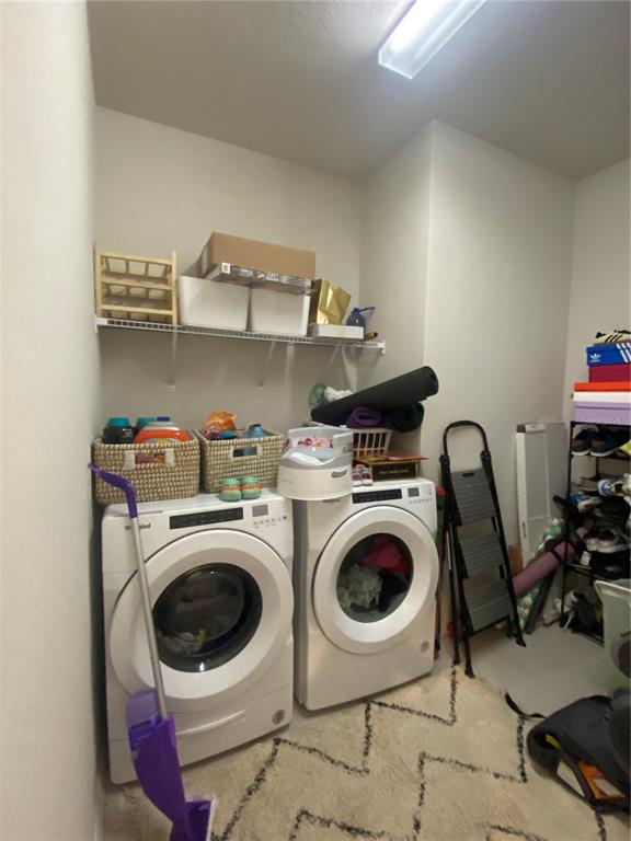 9610 Rally Spring Loop Wesley Chapel, FL 33545 - Photo 21 of 38 a utility room with dryer and washer