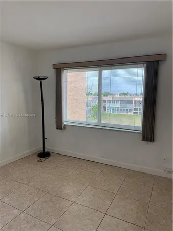 a white toilet sitting next to a shower curtain