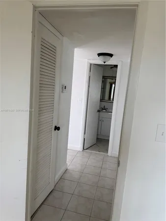 a room with two mirror and a sink
