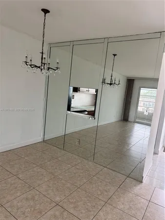 a view of a building with car parked