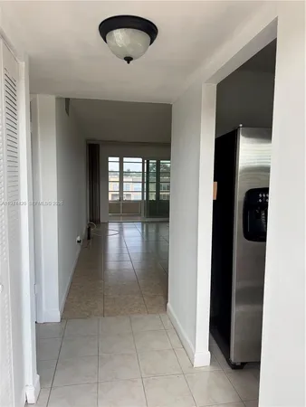a view of an empty room with a fireplace