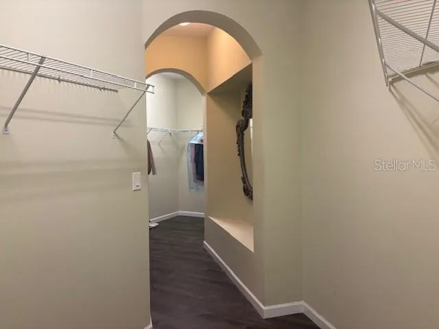 a view of a room with wooden door