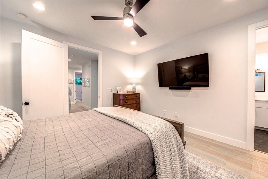 916 East 50th Street, Unit 1 Austin, TX 78751 - Photo 14 of 36 The primary bedroom is completely separate from the two secondary bedrooms and bathroom on the floor. Conveniently located next to the laundry and a huge storage closet.