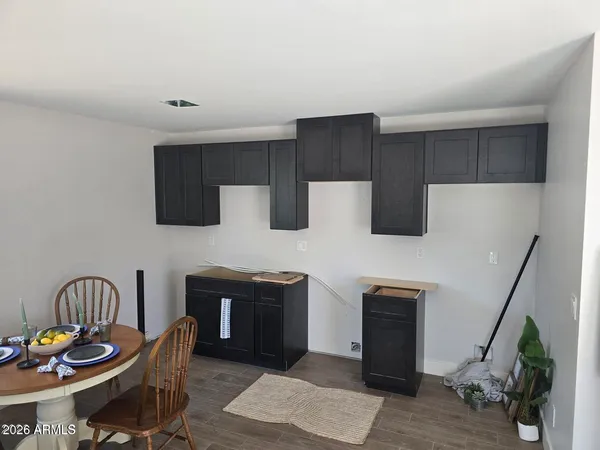 a kitchen with stainless steel appliances granite countertop a stove a sink dishwasher and a microwave