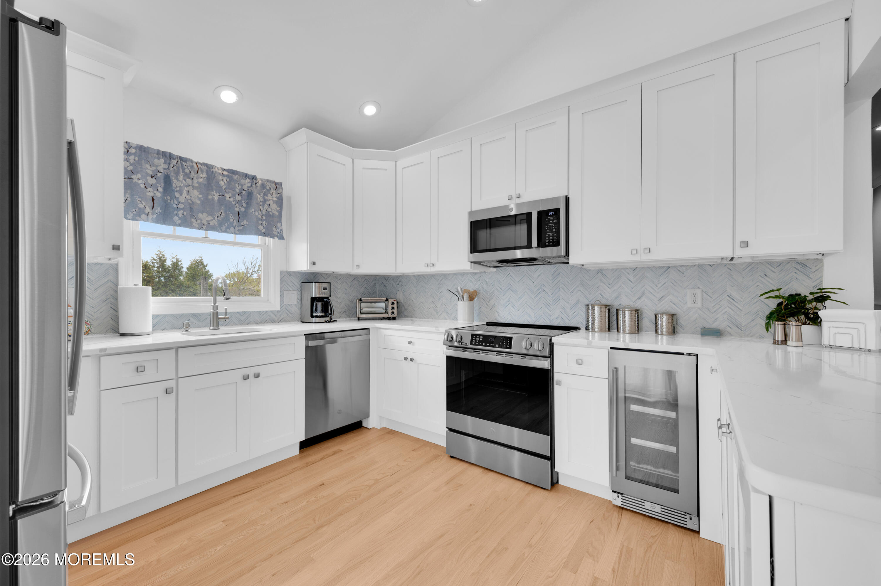 41 A Mount Street Bay Head, NJ 08742 - Photo 2 of 33 a kitchen with cabinets stainless steel appliances and a window