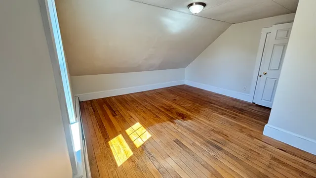a view of balcony with wooden floor