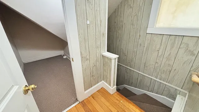 a kitchen with a sink a stove top oven and white cabinets