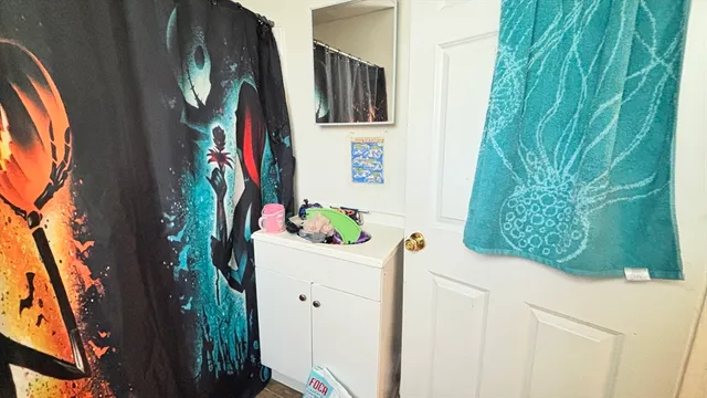 a room with furniture and a potted plant