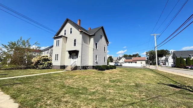 a picture of a bench in front of a wall