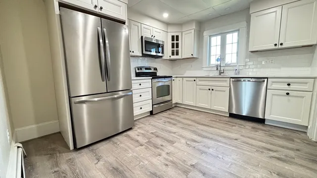 a bathroom with a toilet and a bathtub