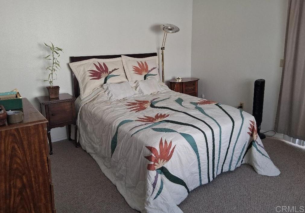 426 Sacramento Avenue Spring Valley, CA 91977 - Photo 14 of 19 a bed sitting in a bedroom next to a lamp