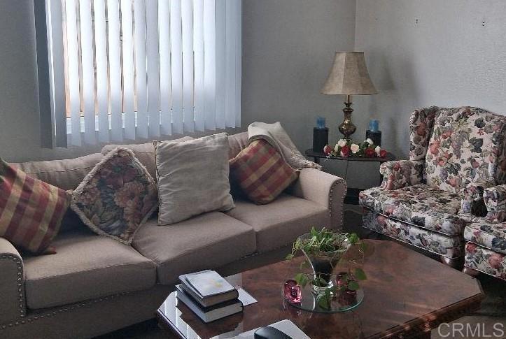 426 Sacramento Avenue Spring Valley, CA 91977 - Photo 4 of 19 a living room with furniture chess board and a window