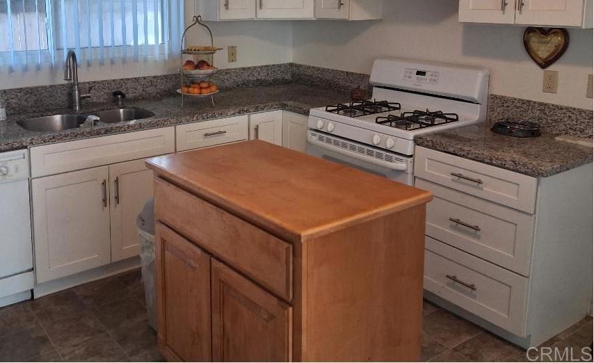 426 Sacramento Avenue Spring Valley, CA 91977 - Photo 8 of 19 a kitchen with cabinets appliances and a sink
