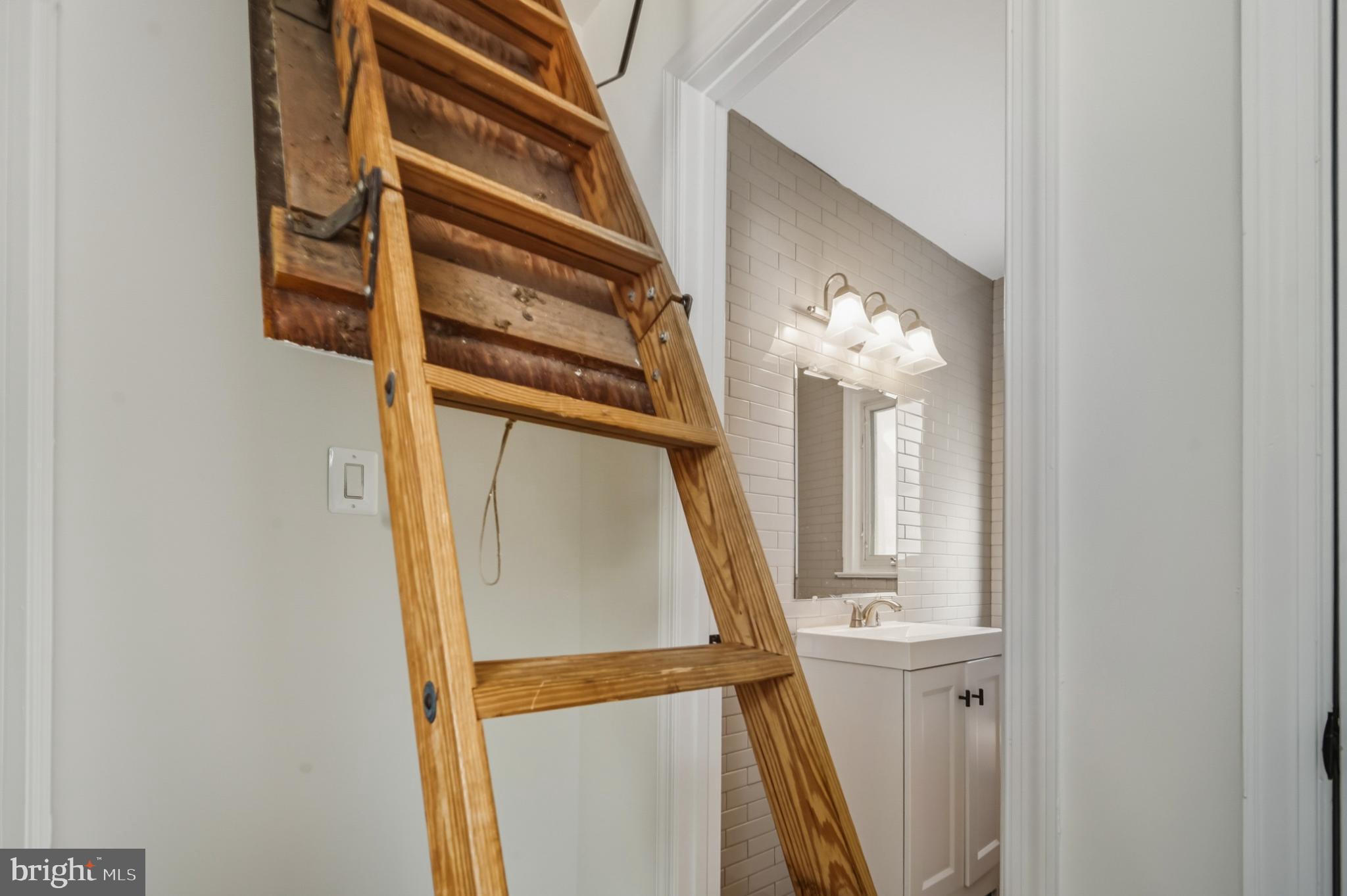 2110 Suitland Terrace Southeast Washington, DC 20020 - Photo 11 of 16 a view of staircase with white walls and a window