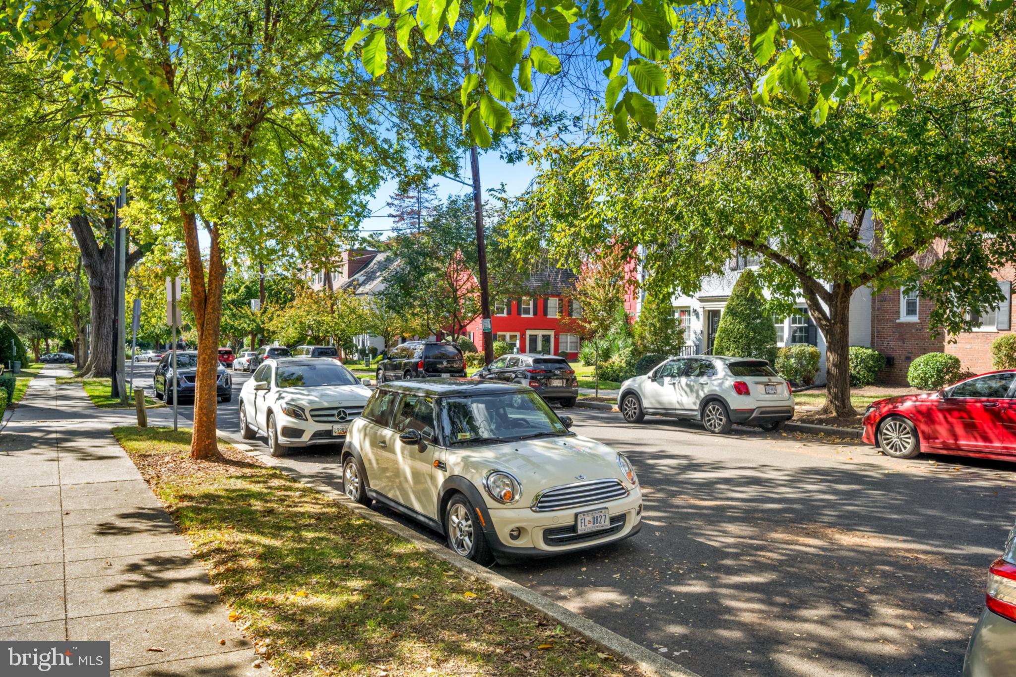 2110 Suitland Terrace Southeast Washington, DC 20020 - Photo 14 of 16 a white house that has a tree in front of it
