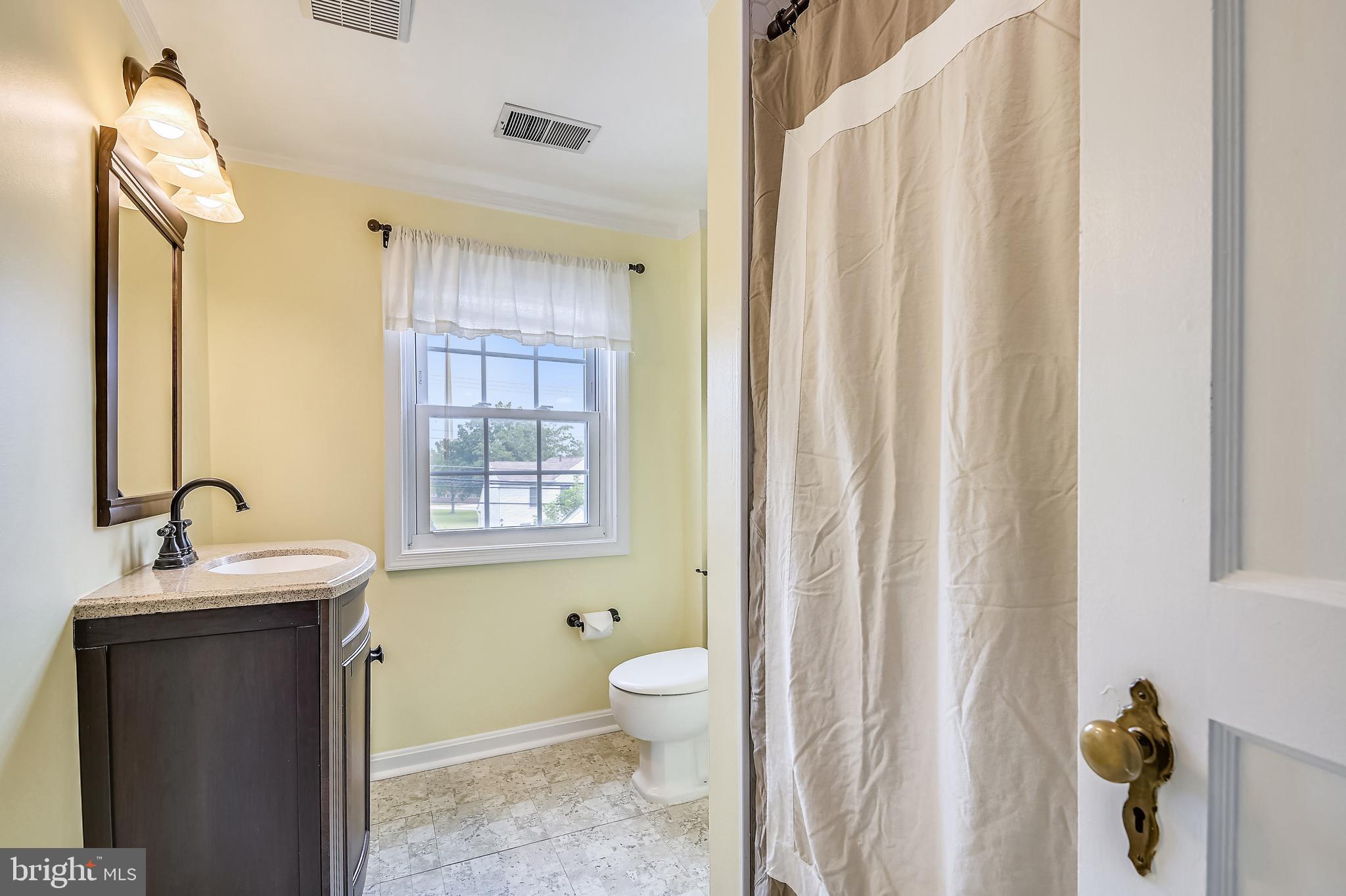 3300 Willoughby Road Baltimore, MD 21234 - Photo 21 of 36 BRIGHT AND SUNNY HALL BATH W/REAR FACING WINDOW