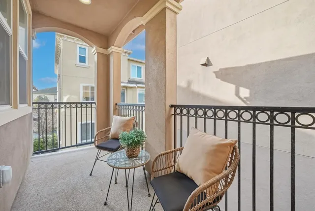 a white toilet sitting next to a bathroom sink