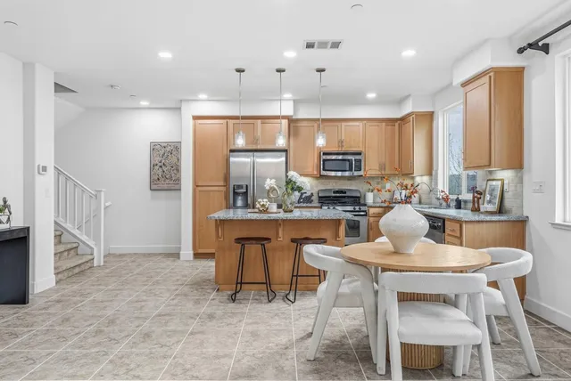 a bathroom with double sink and a mirror