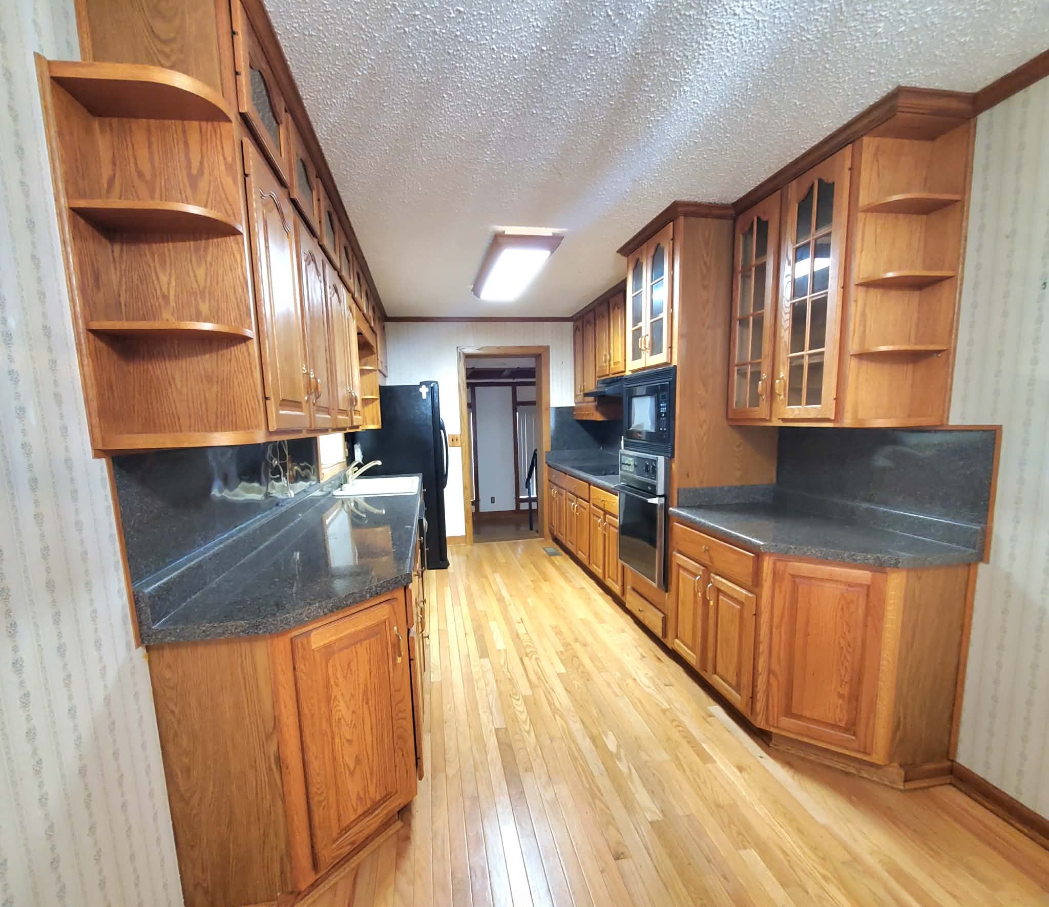 18 Roberts Lane Lebanon, TN 37087 - Photo 14 of 34 a view of kitchen with cabinets and wooden floor