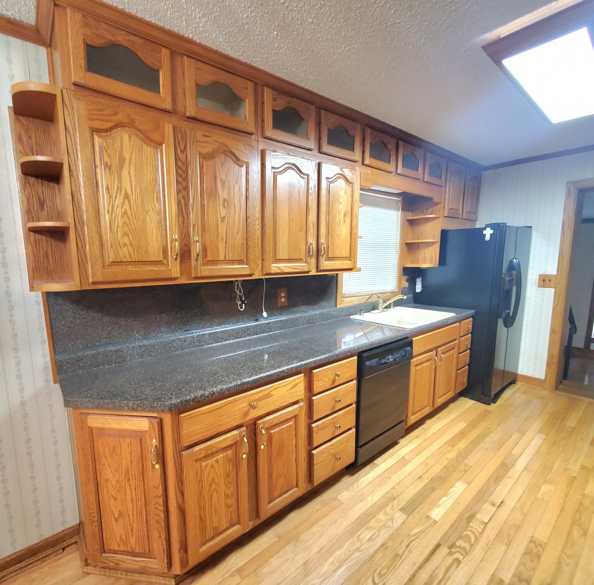 18 Roberts Lane Lebanon, TN 37087 - Photo 15 of 34 a kitchen with stainless steel appliances granite countertop a sink a stove cabinets and wooden floor