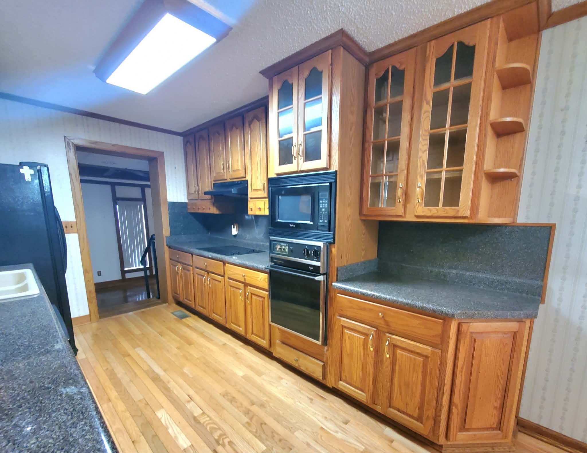18 Roberts Lane Lebanon, TN 37087 - Photo 16 of 34 a kitchen with stainless steel appliances granite countertop a stove a sink and a refrigerator