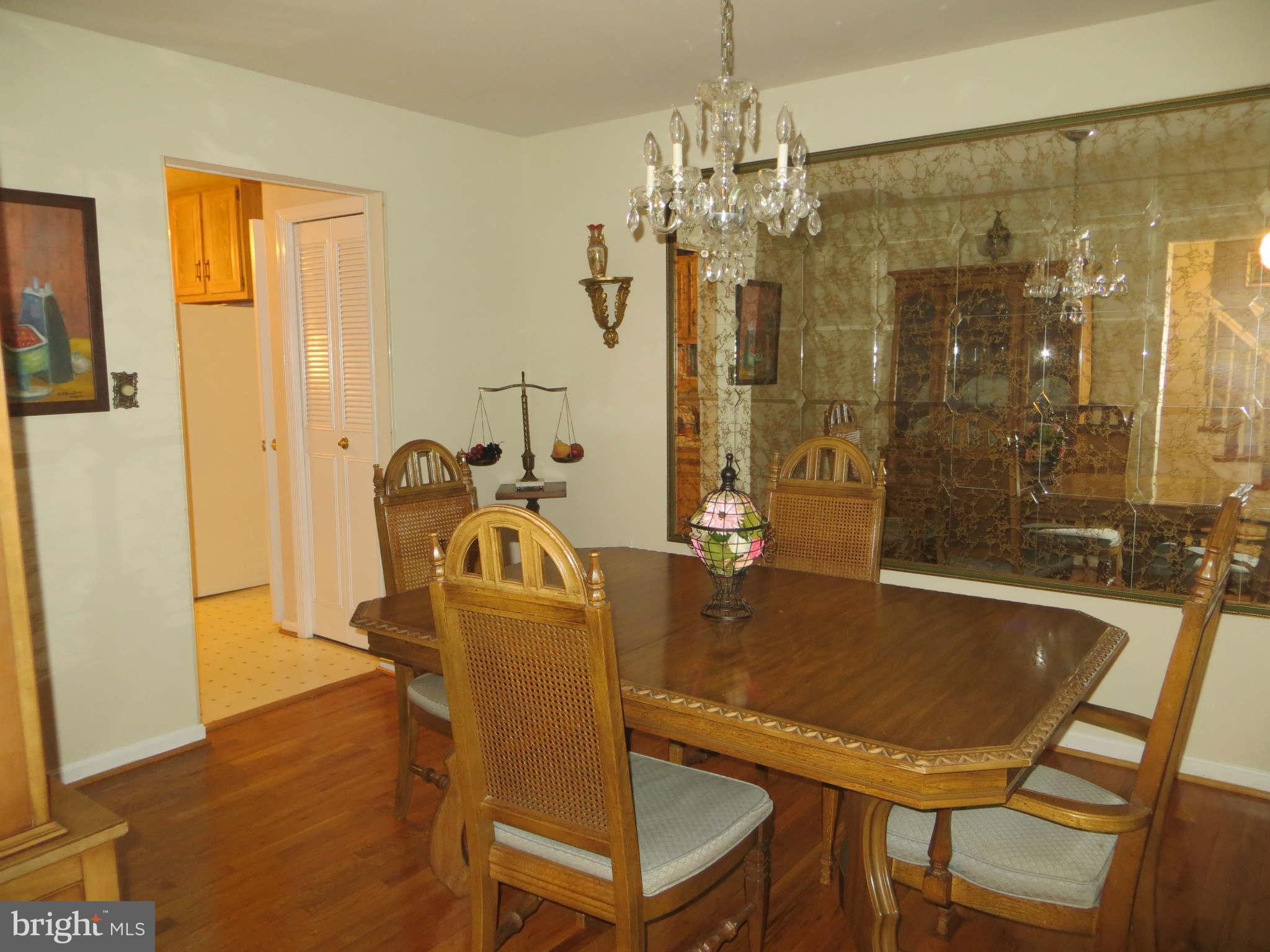 12504 Kuhl Road Silver Spring, MD 20902 - Photo 3 of 27 a view of a dining room with furniture and chandelier