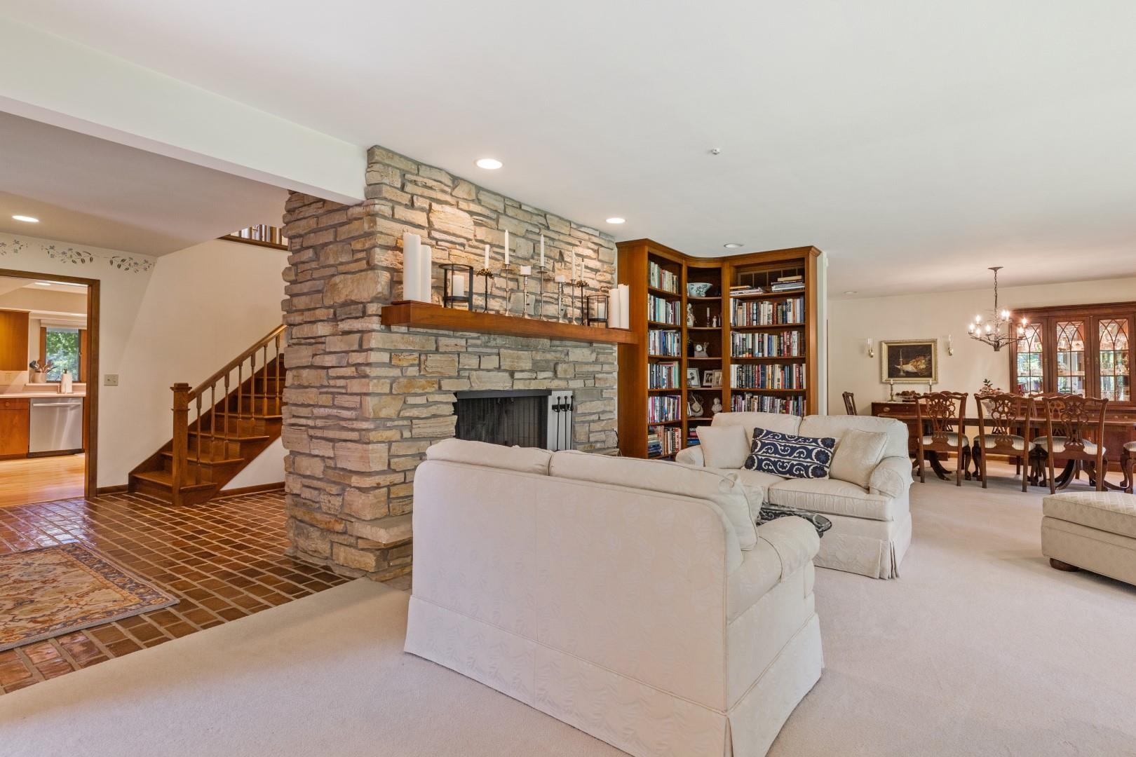6351 Harlem Road Loves Park, IL 61111 - Photo 17 of 74 a living room with furniture and a fireplace