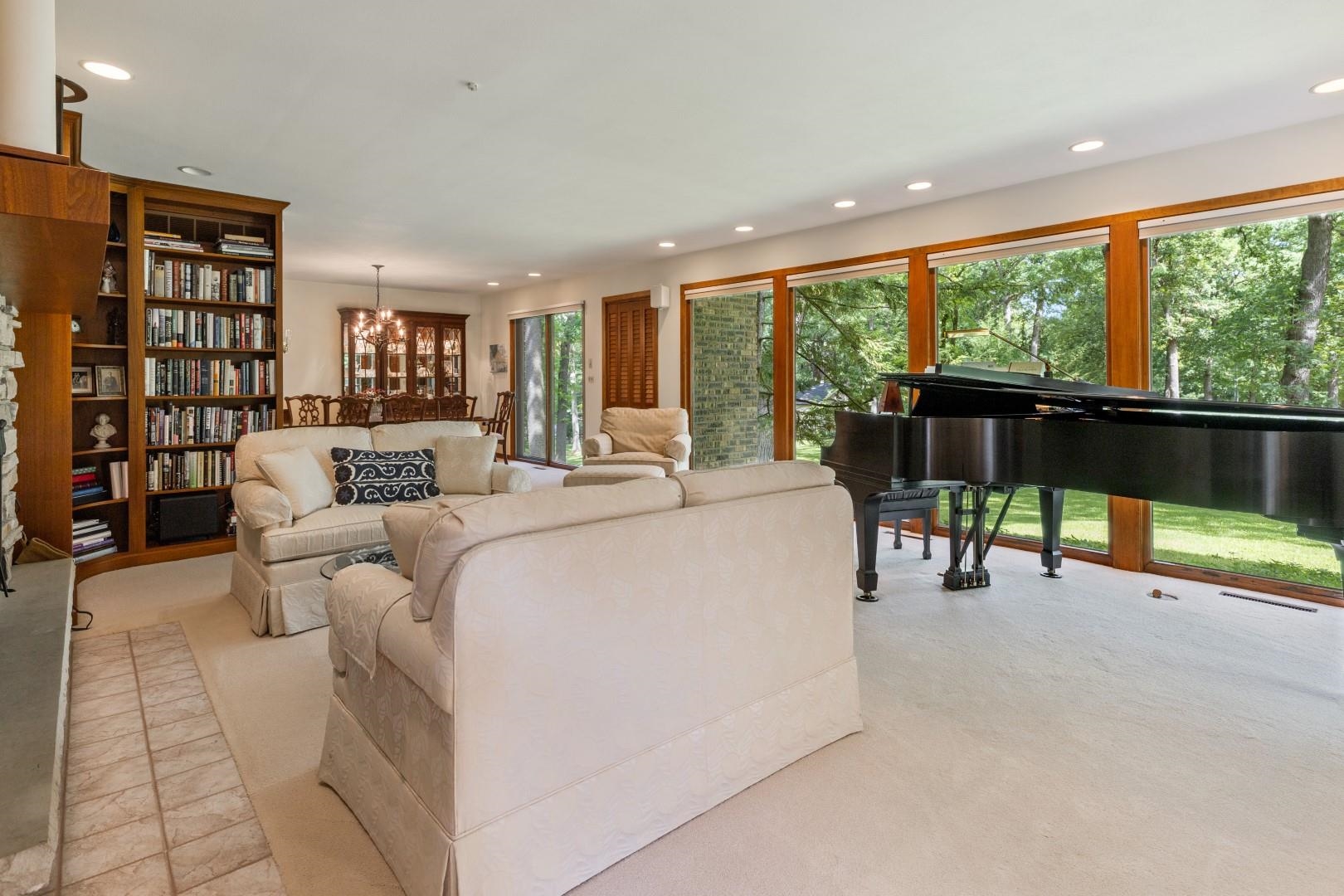 6351 Harlem Road Loves Park, IL 61111 - Photo 18 of 74 a living room with furniture and a floor to ceiling window