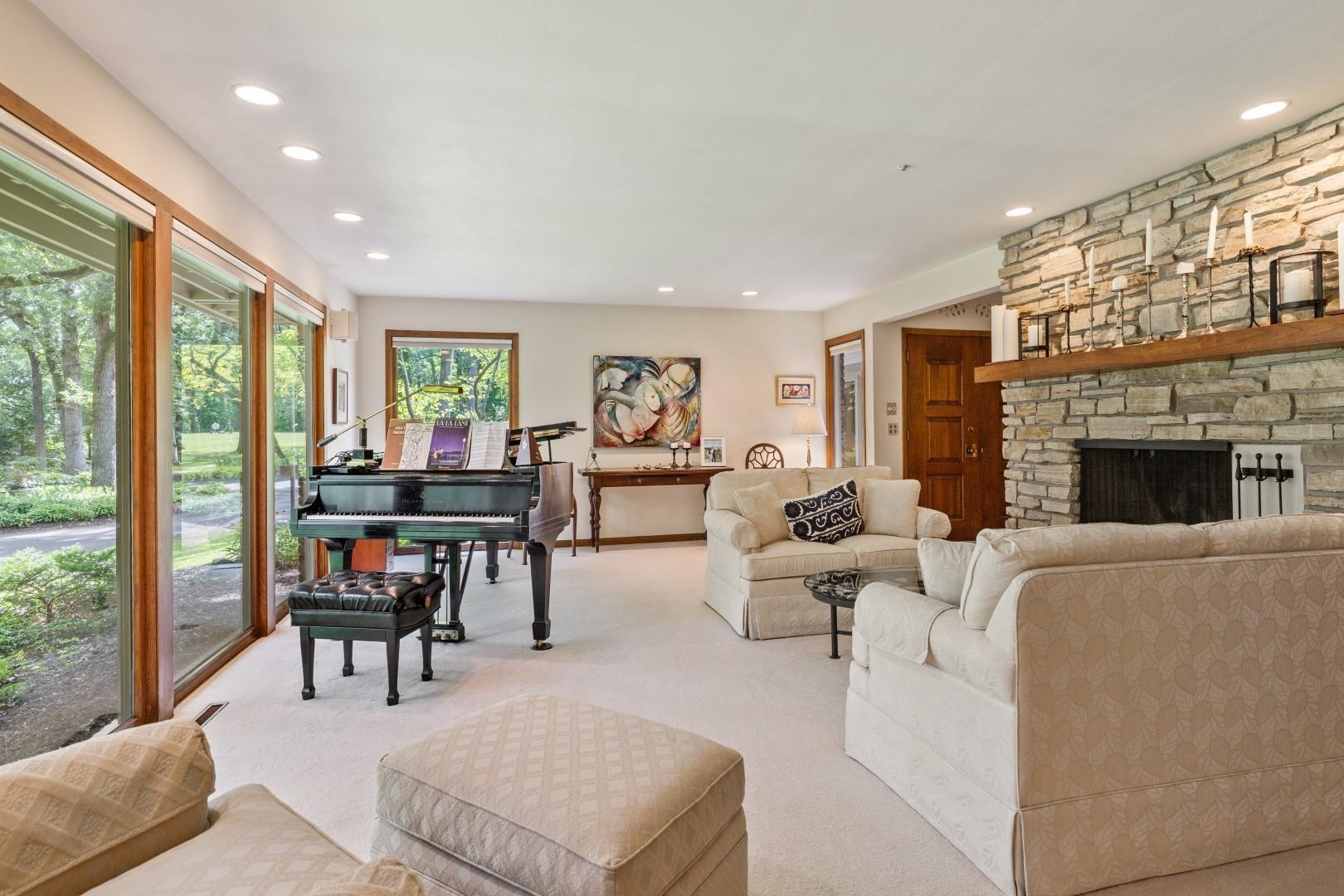 6351 Harlem Road Loves Park, IL 61111 - Photo 19 of 74 a living room with furniture and a fireplace