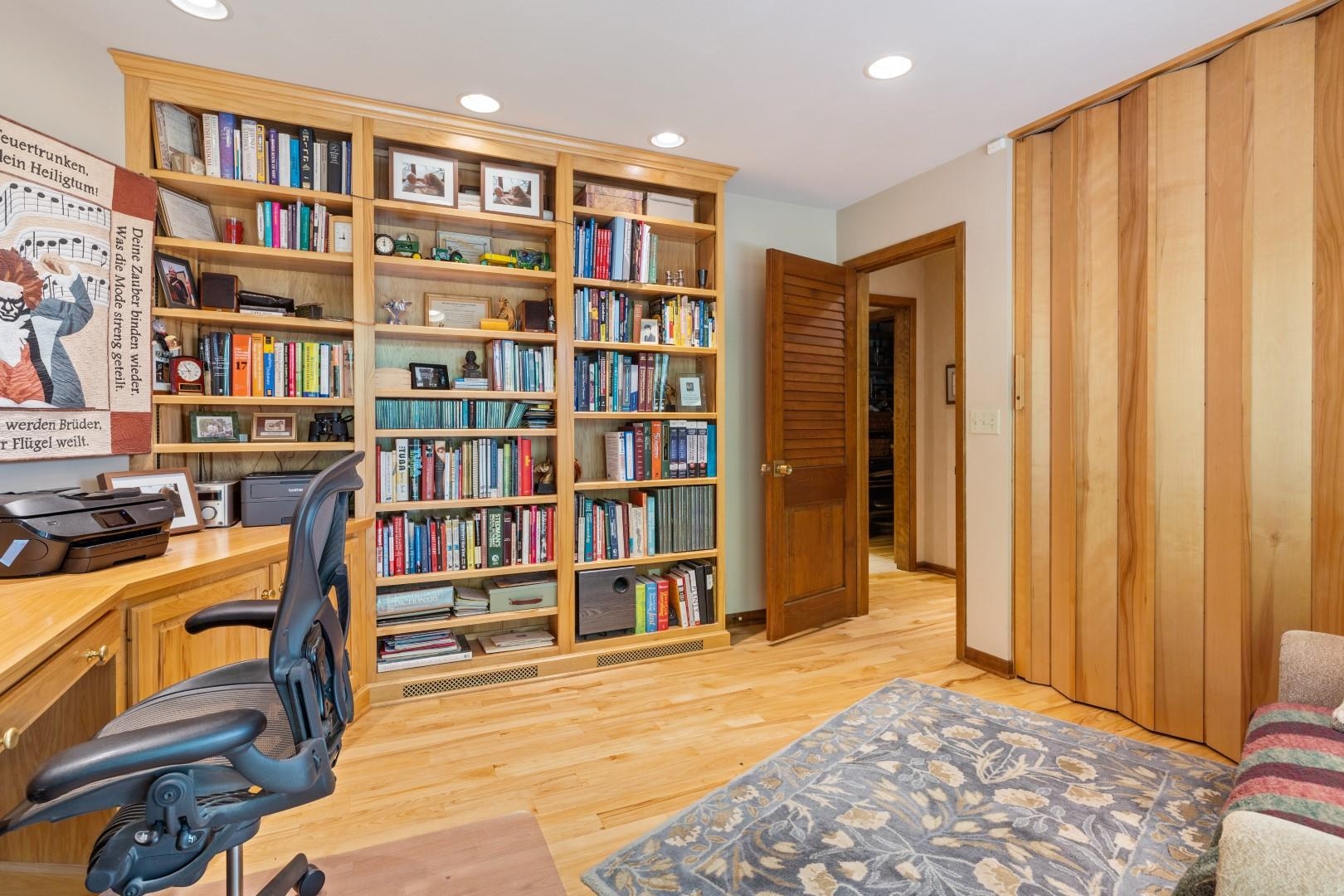 6351 Harlem Road Loves Park, IL 61111 - Photo 25 of 74 a view of a bedroom with furniture and book shelf