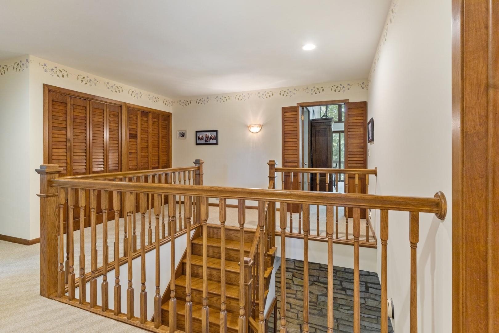 6351 Harlem Road Loves Park, IL 61111 - Photo 28 of 74 a view of staircase with railing and a window
