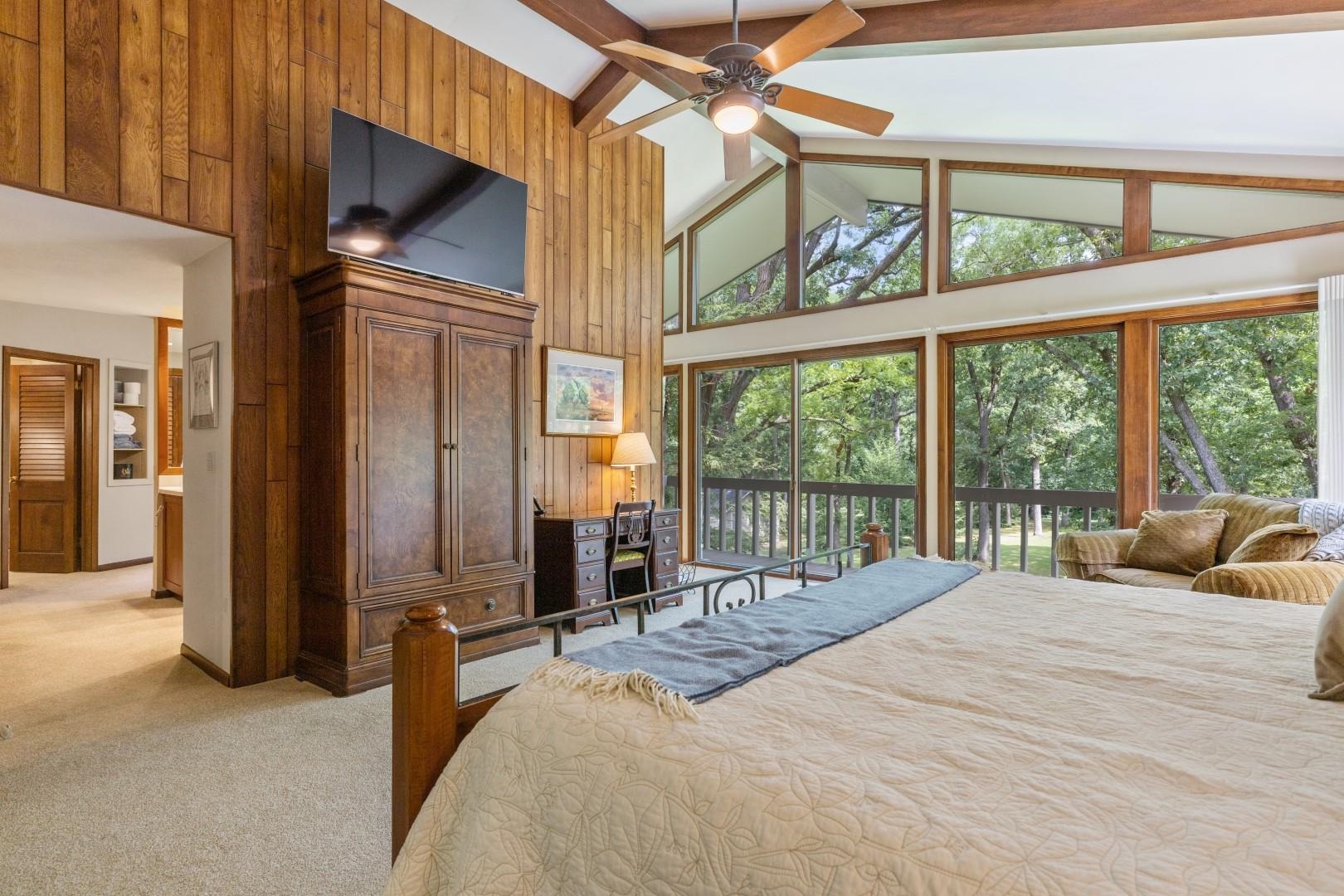 6351 Harlem Road Loves Park, IL 61111 - Photo 30 of 74 a bedroom with a bed and a large window with the view of balcony