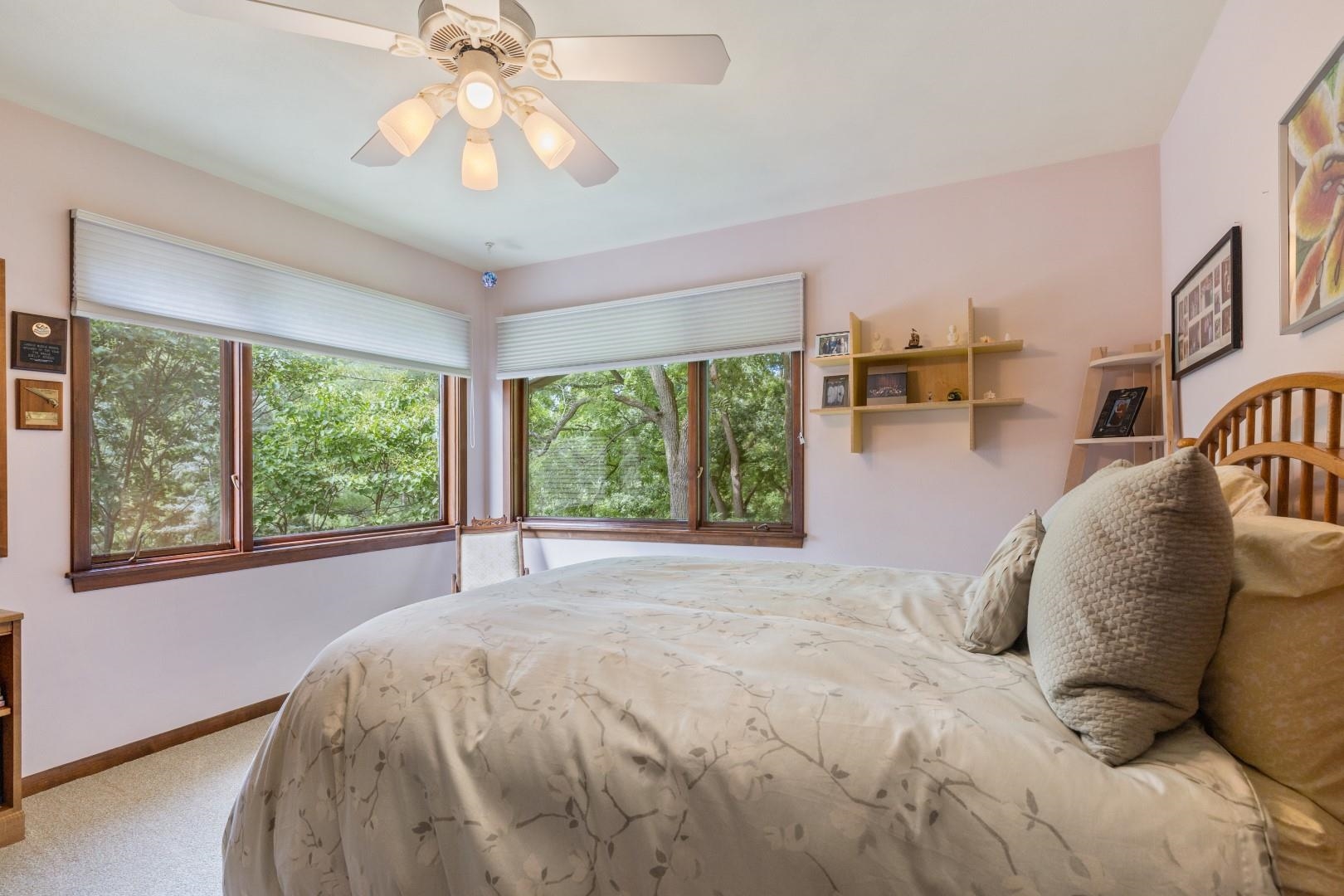 6351 Harlem Road Loves Park, IL 61111 - Photo 37 of 74 a bed sitting in a bedroom next to a window