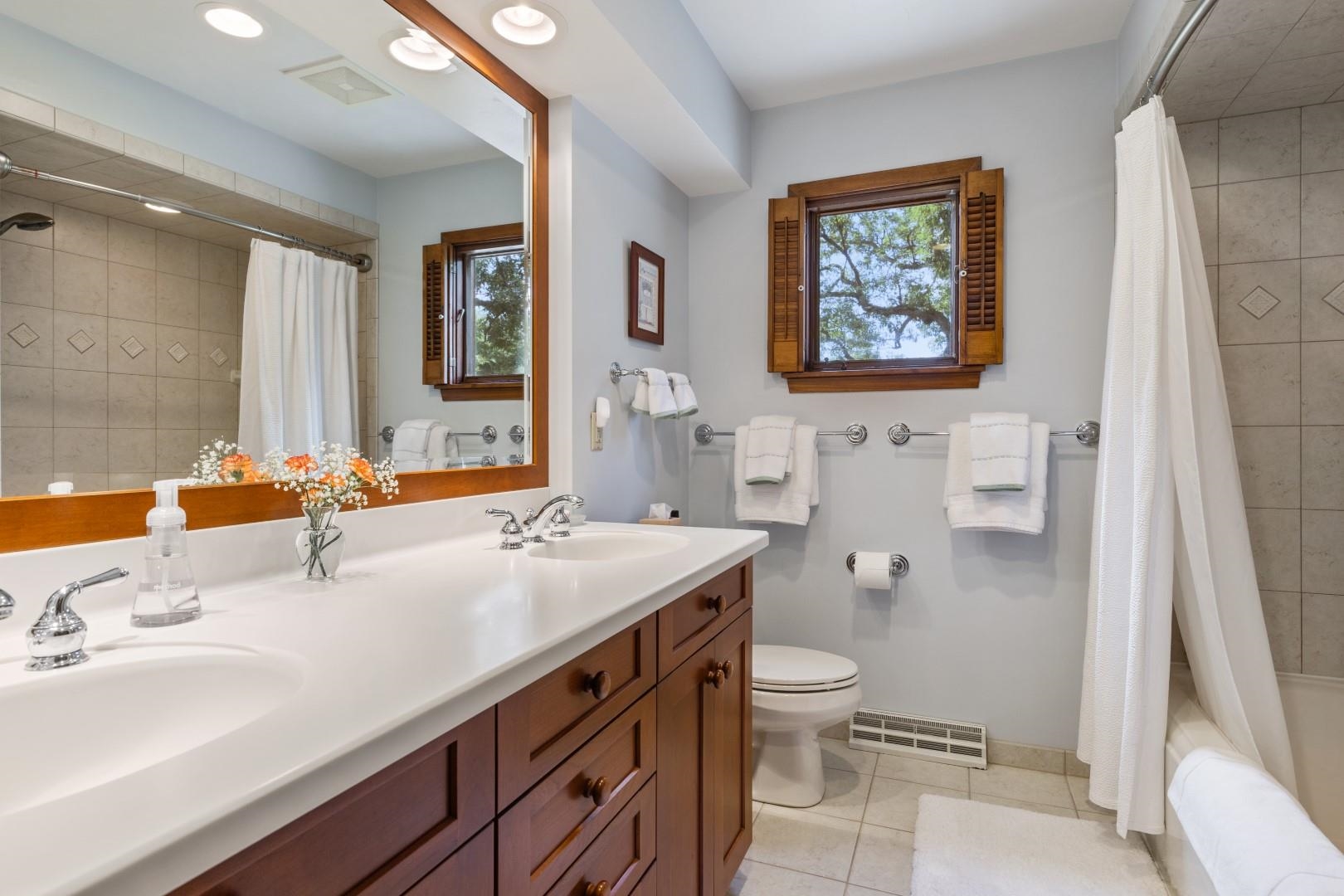 6351 Harlem Road Loves Park, IL 61111 - Photo 39 of 74 a bathroom with a sink a toilet and shower