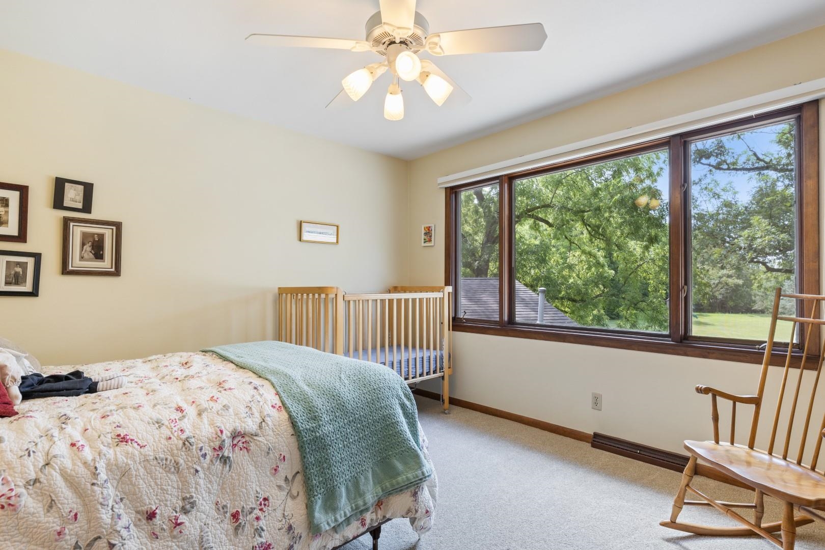 6351 Harlem Road Loves Park, IL 61111 - Photo 40 of 74 a bedroom with a bed and a large window
