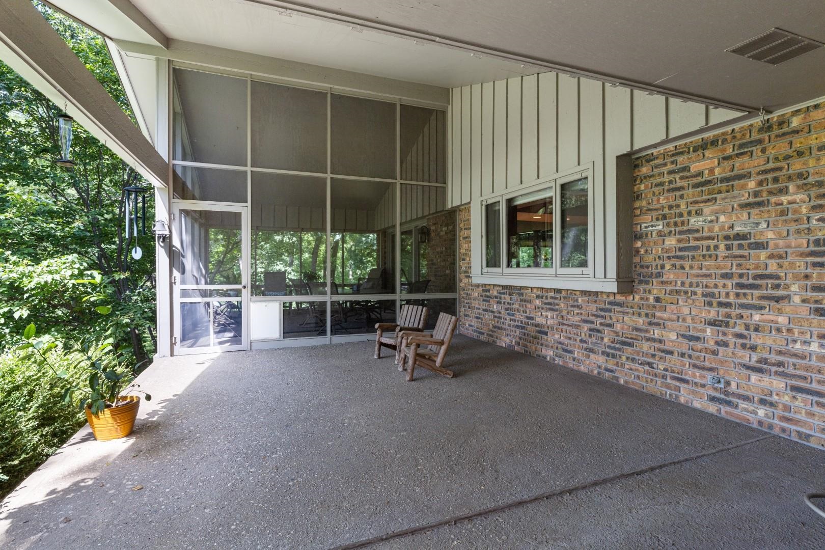 6351 Harlem Road Loves Park, IL 61111 - Photo 50 of 74 a view of a patio with table and chairs and potted plants