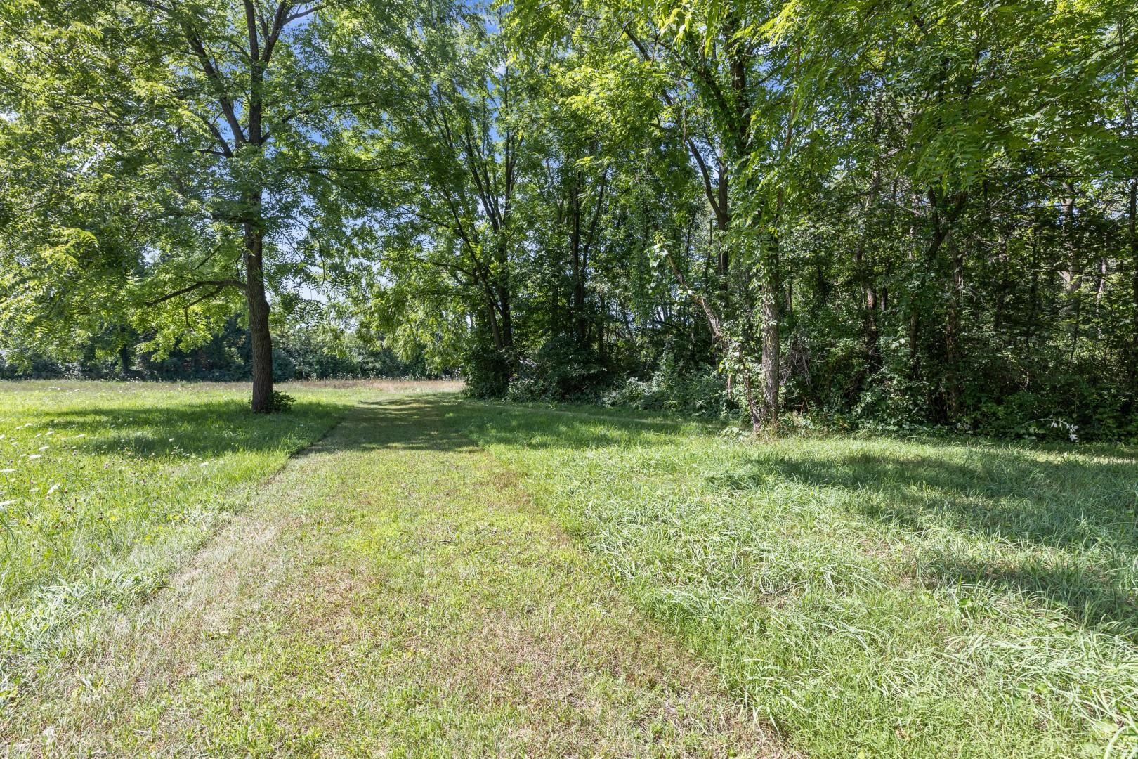 6351 Harlem Road Loves Park, IL 61111 - Photo 53 of 74 a view of outdoor space with trees all around