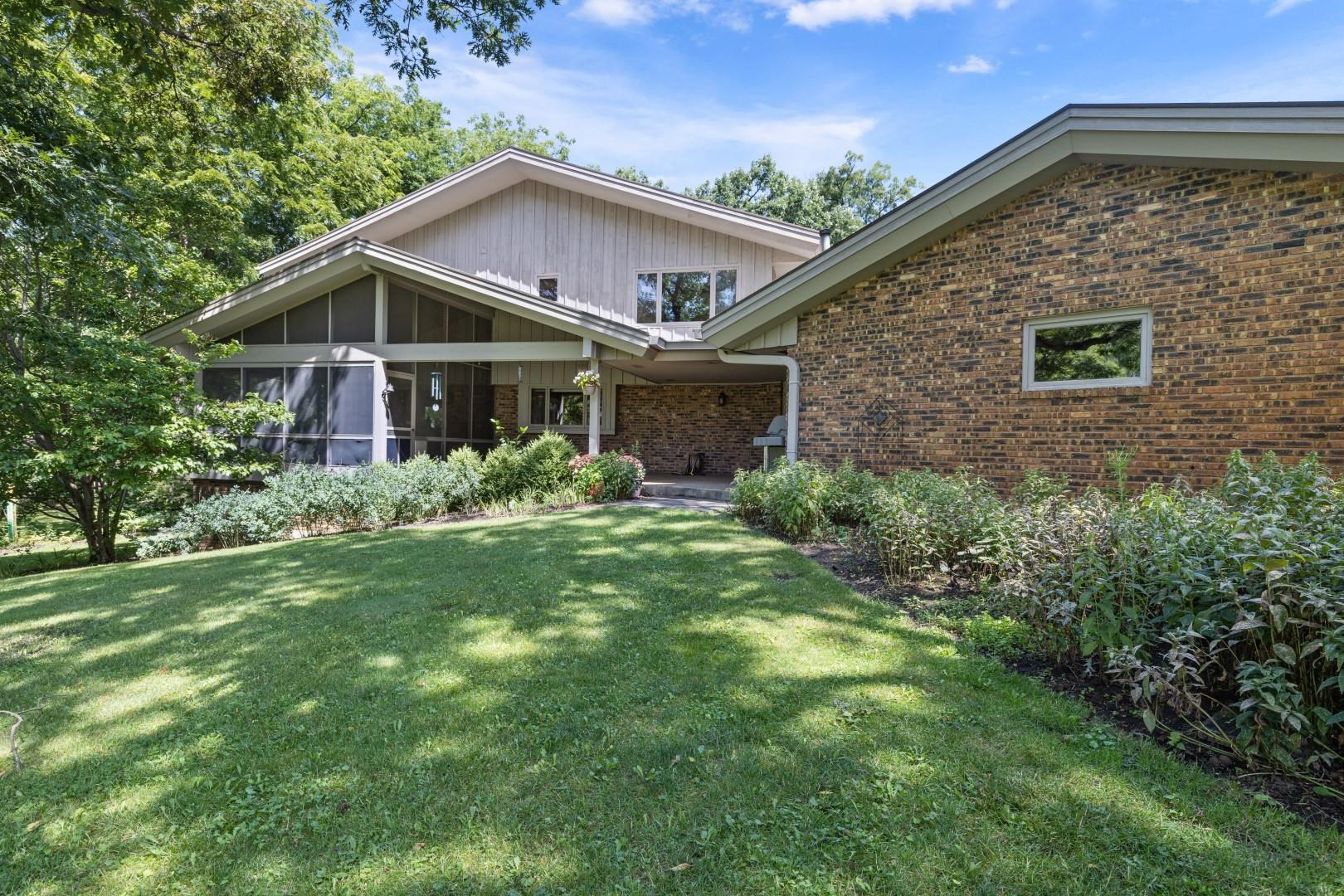 6351 Harlem Road Loves Park, IL 61111 - Photo 59 of 74 a front view of a house with garden