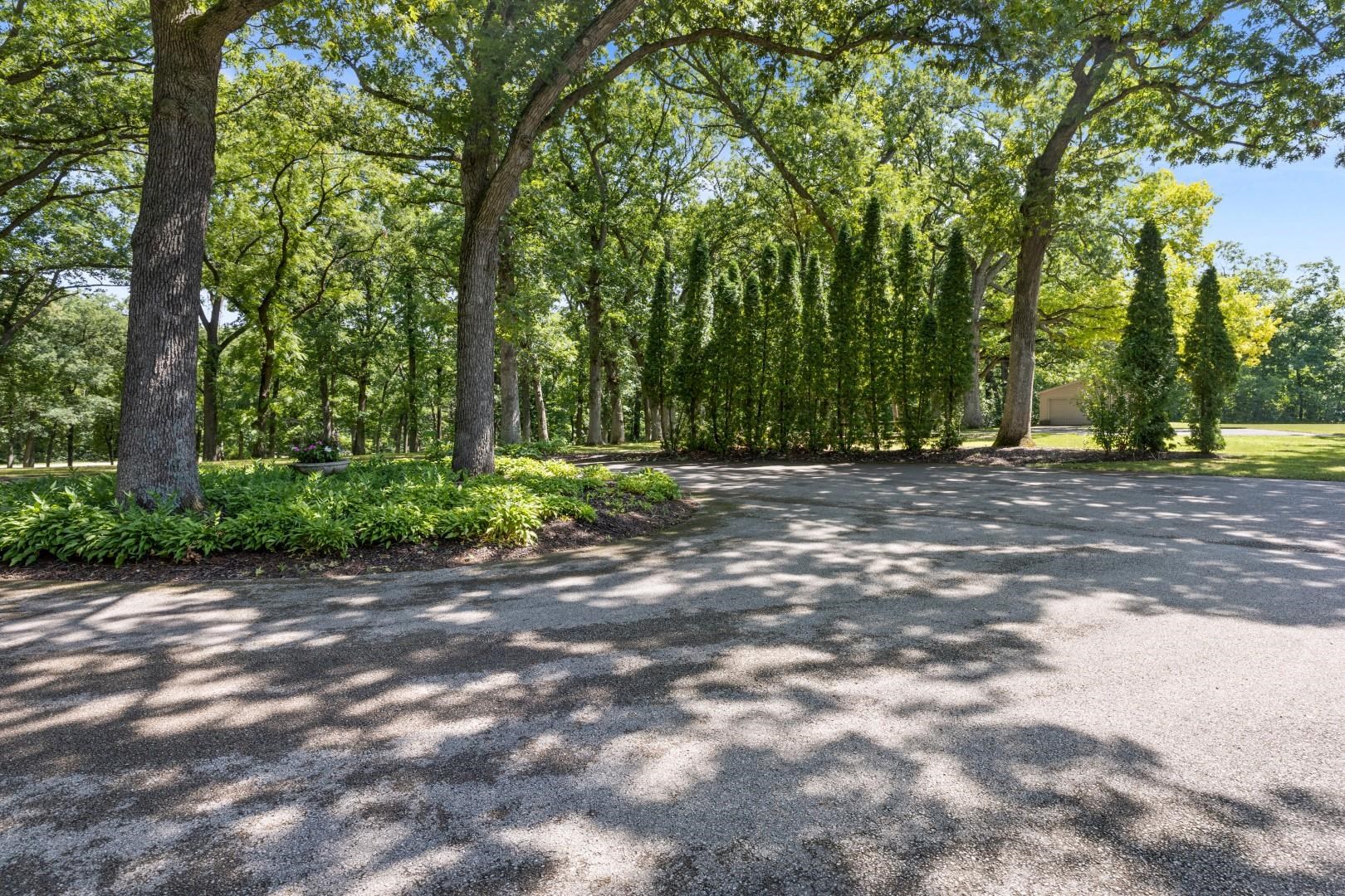 6351 Harlem Road Loves Park, IL 61111 - Photo 66 of 74 a view of a yard with plants and trees