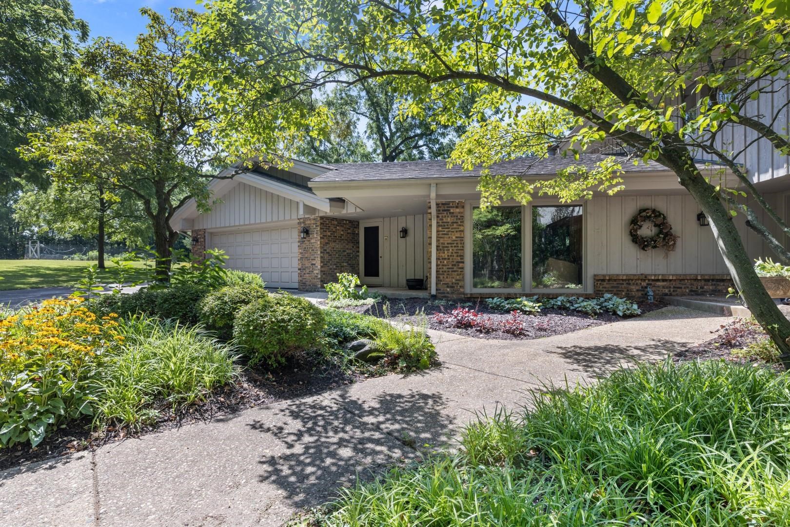 6351 Harlem Road Loves Park, IL 61111 - Photo 73 of 74 a front view of a house with garden