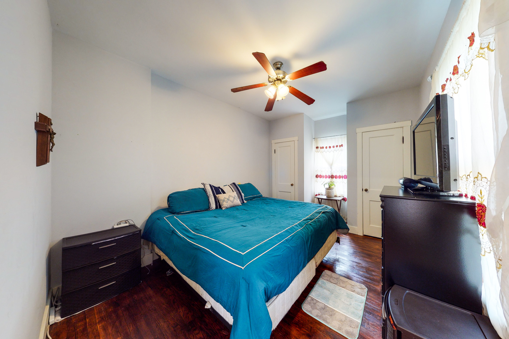 658 Linden Avenue Elgin, IL 60120 - Photo 14 of 28 a bedroom with a bed and a tv