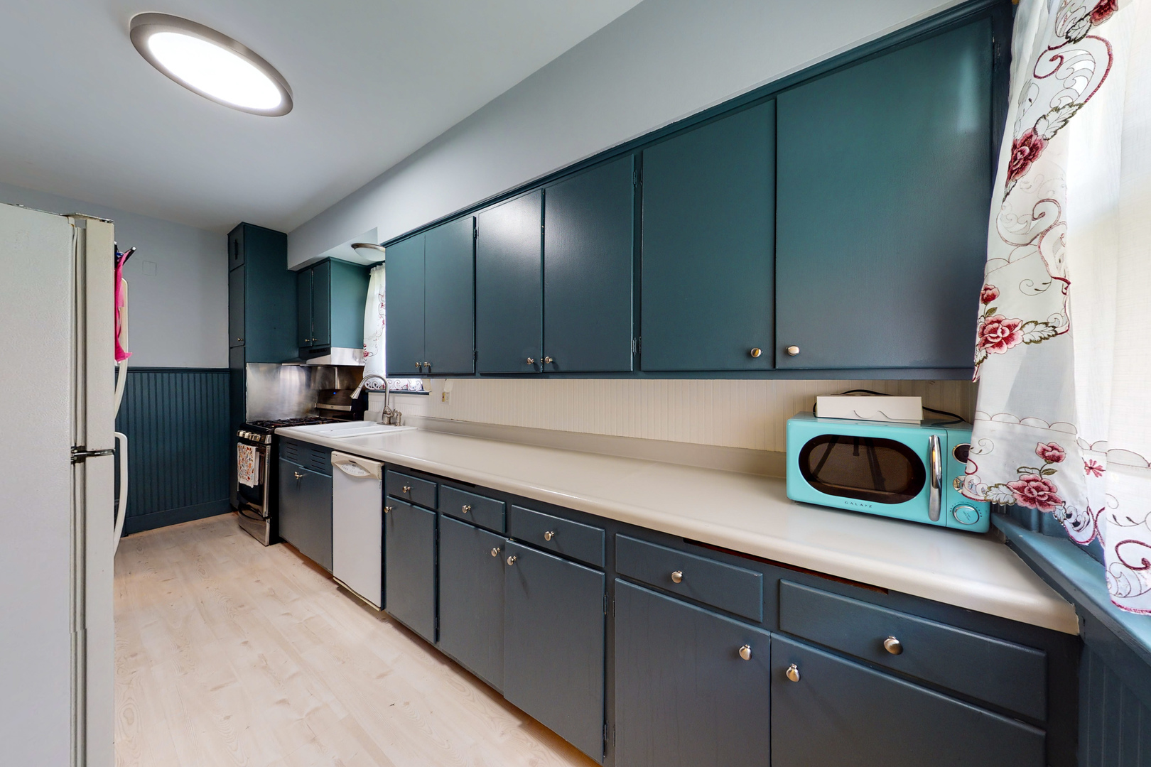 658 Linden Avenue Elgin, IL 60120 - Photo 7 of 28 a kitchen with stainless steel appliances granite countertop a sink and cabinets